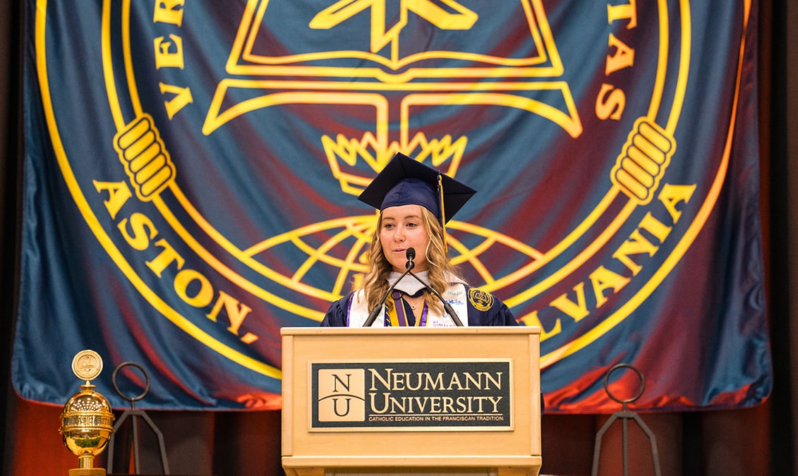 Valedictorian tips her cap to faculty, teammates